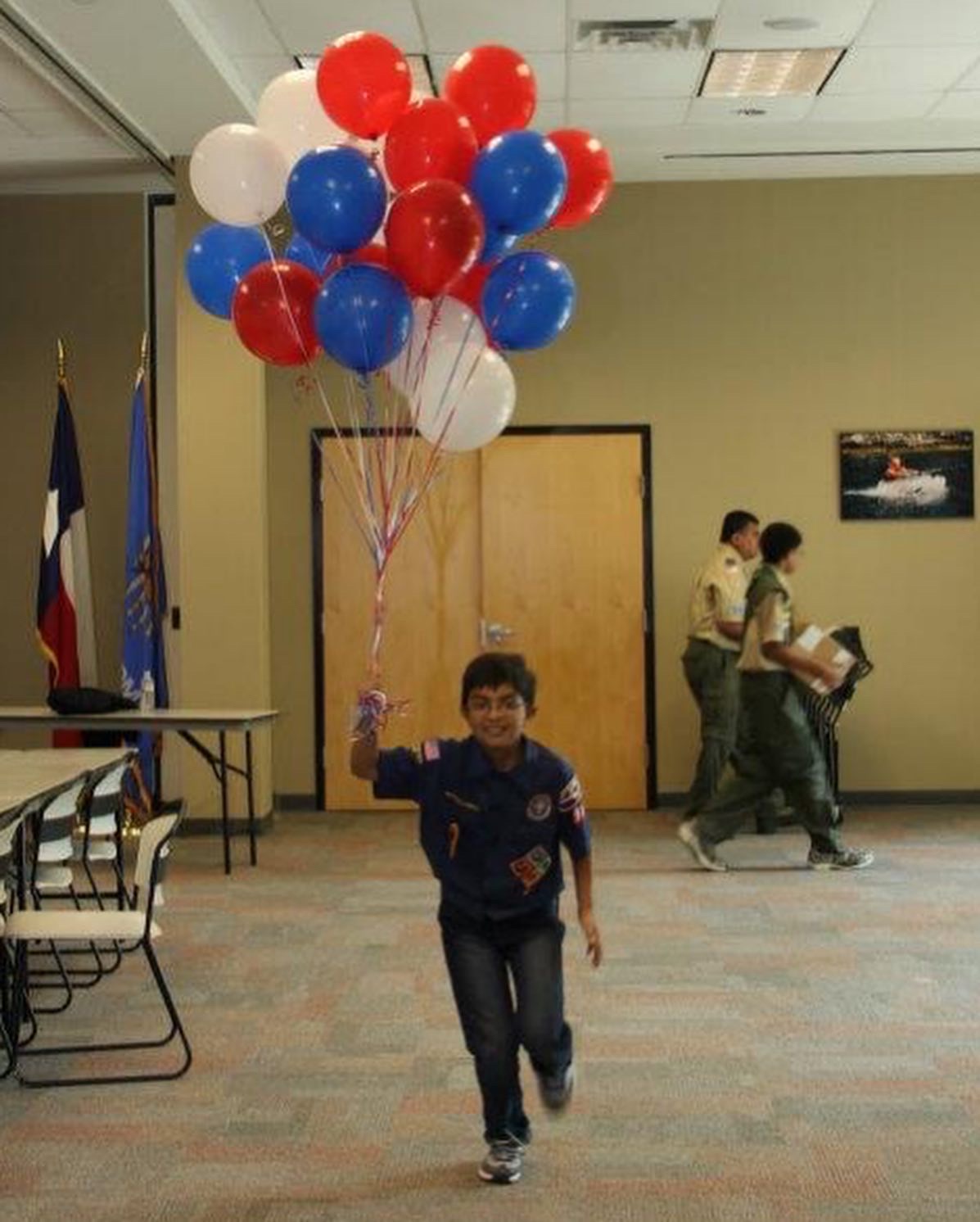 Dave as a child running with balloons